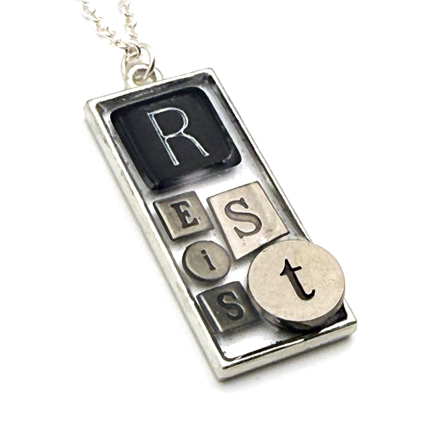 RESIST Necklace – Silver Mixed Metal Bezel | Wearable Art Word Jewelry