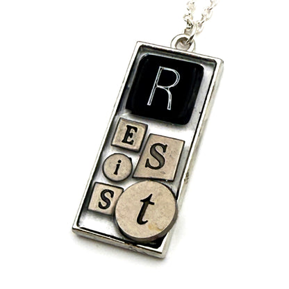 RESIST Necklace – Silver Mixed Metal Bezel | Wearable Art Word Jewelry