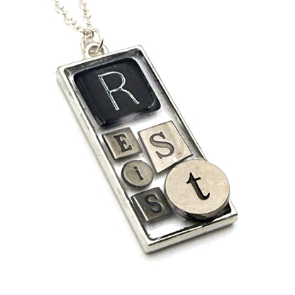 RESIST Necklace – Silver Mixed Metal Bezel | Wearable Art Word Jewelry